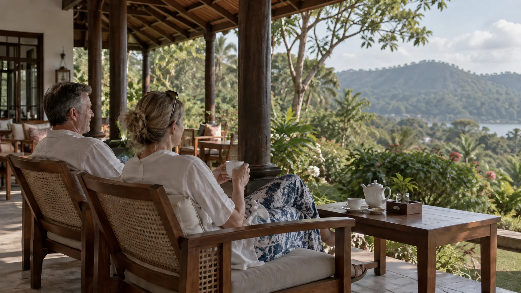 Guests relaxing on a Sri Lankan hotel veranda surrounded by tropical scenery